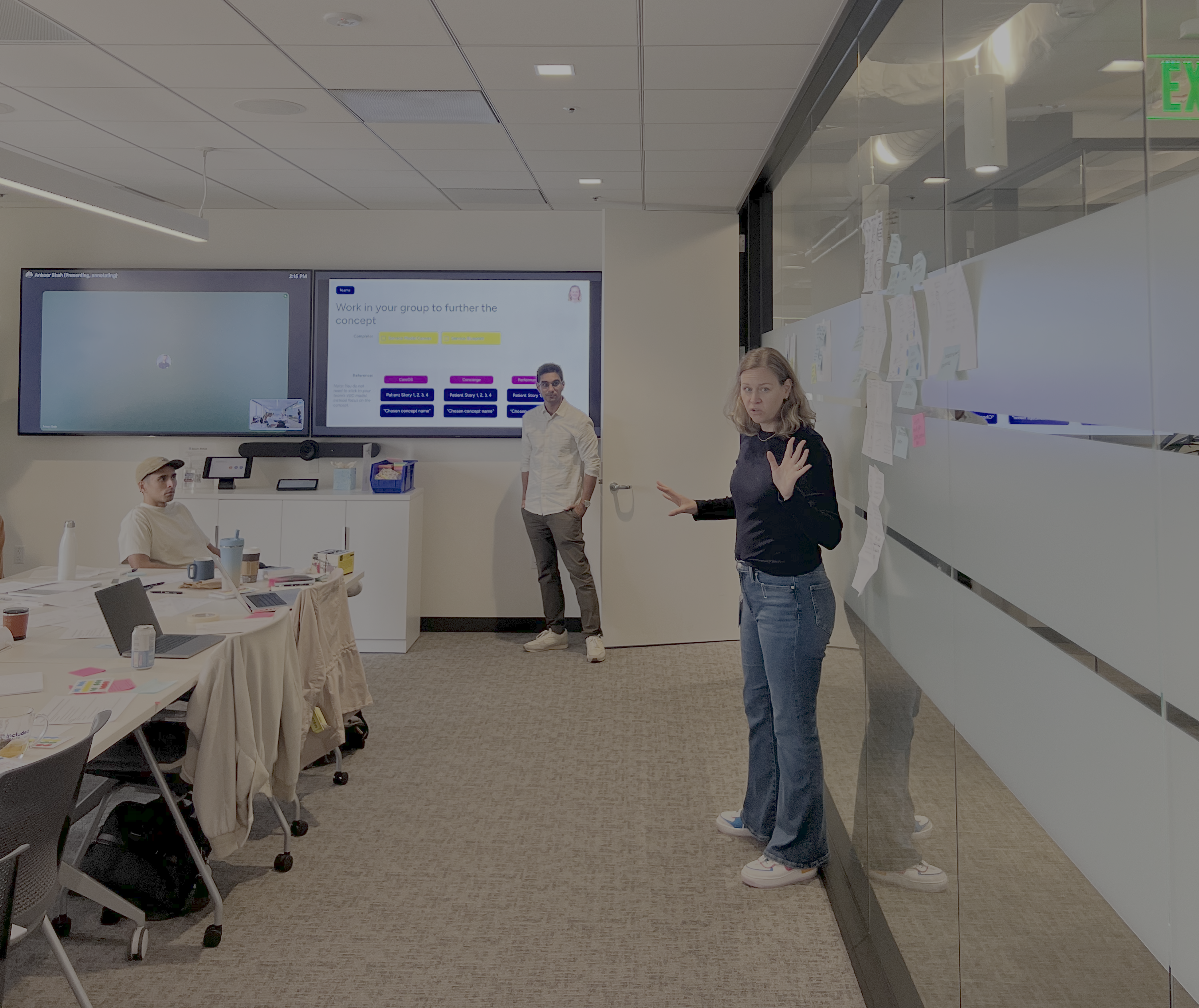 Emily facilitating the strategy sprint — presenting to the cross-functional group in the working session room